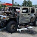 A Hummer vehicle is engulfed by fire due to panic caused by gas shortages