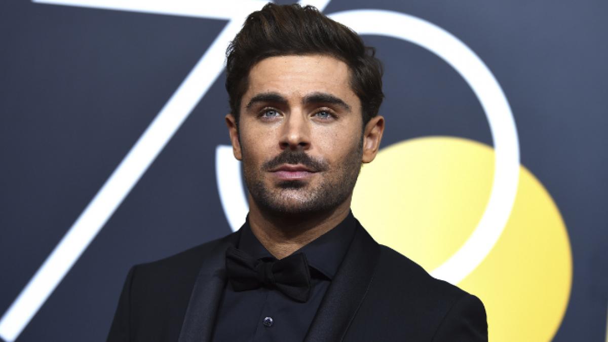 Zac Efron shows off his face in a new photo promoting his Netflix series