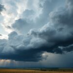 Storm clouds gathering over a snowy landscape in the U.S.