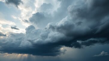 Storm clouds gathering over a snowy landscape in the U.S.